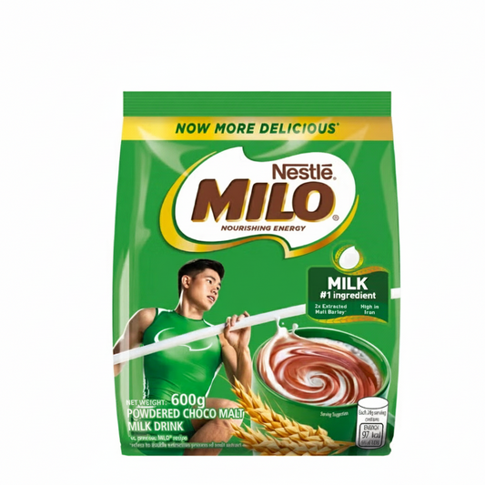 Green Nestle Milo packaging with a person holding a scoop and a cup of Milo.