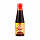 Bottle of fish ball sauce with a red cap on a white background
