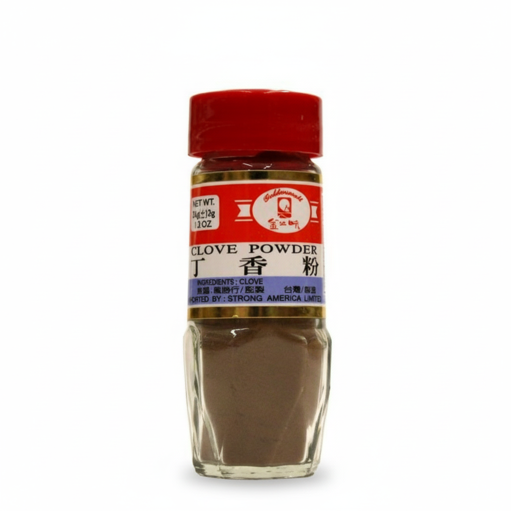 Bottle of clove powder with a red lid on a white background
