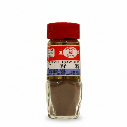 Bottle of clove powder with a red lid on a white background