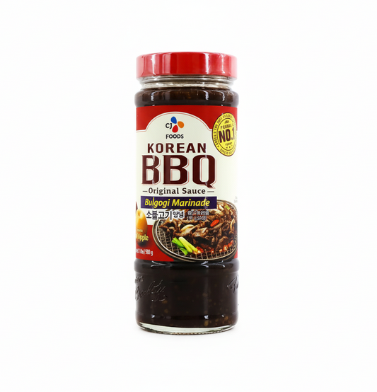 Korean BBQ sauce bottle with red lid on a white background